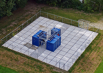 Electrolyser units in these blue containers are producing high purity green hydrogen gas for heating homes in a nearby apartment block in Rotterdam, Netherlands
